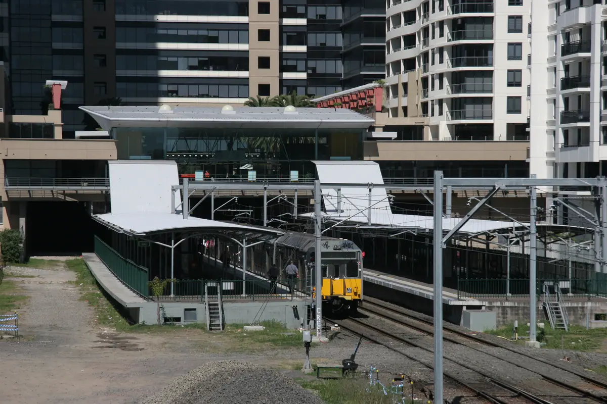 St Leonards railway station framed by the suburb's commercial towers